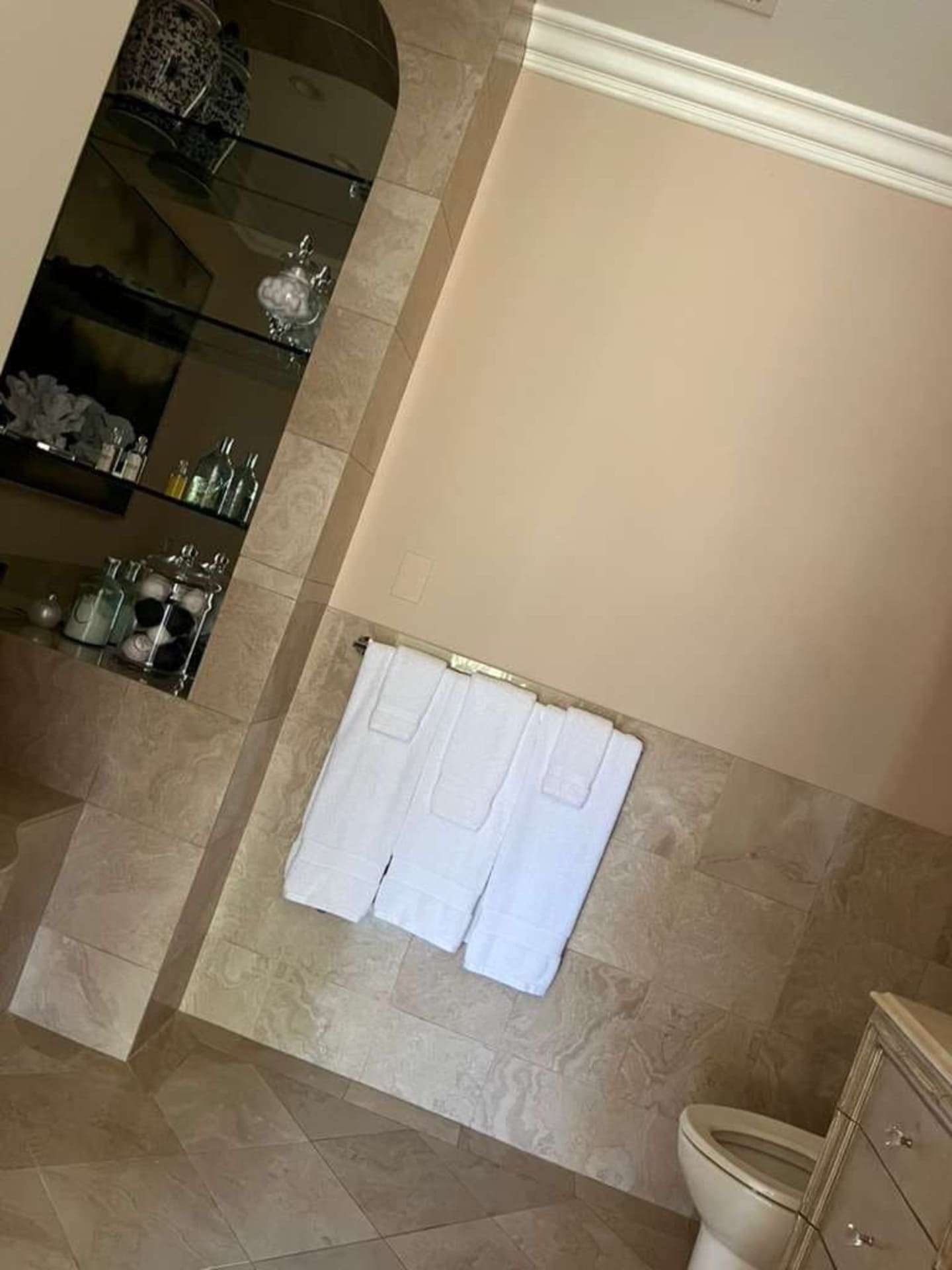 Bathroom with clean surfaces and towels perfectly placed after standard cleaning in Poway
